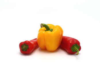 Composition of yellow and red sweet peppers of different sizes on a light background. Natural product. Natural color. Close-up.