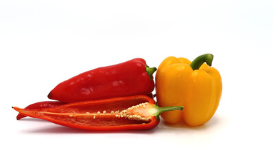 Composition of yellow and red sweet peppers of different sizes on a light background. Natural product. Natural color. Close-up.