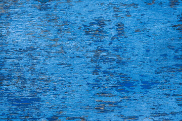 Painted in blue wooden background. Wood texture and paint. The pattern of the grain of the wood. 