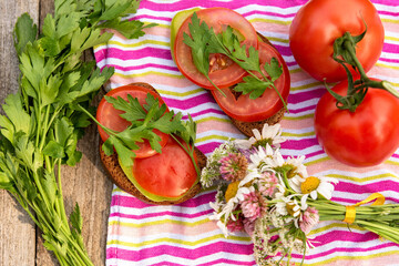 Summer vegetarian sandwiches with tomato and greens.