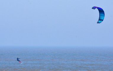 Kite Surfer on the sea Surfer and Kite in view.