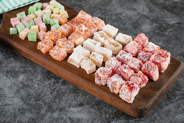 Turkish delight lokum on the wooden board