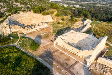 Fototapeta na wymiar Patara (Pttra). Ruins of the ancient Lycian city Patara. Amphi-theatre and the assembly hall of Lycia public. Patara was at the Lycia (Lycian) League's capital. Aerial view shooting. Antalya, TURKEY