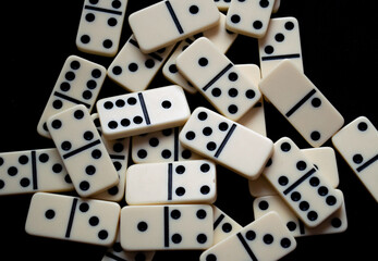 Closeup of a set of scattered domino pieces.
