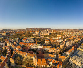 Aerial drone shot of Matthias Church on Buda hill during Budapest sunrise at dawn