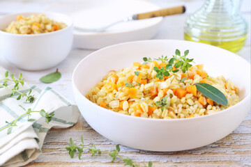 Pearl barley warm salad with carrots and fried onions, thyme garnish