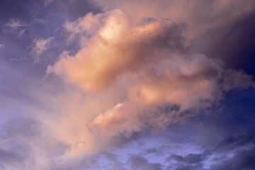 Dramatic clouds during sunset in a blue sky