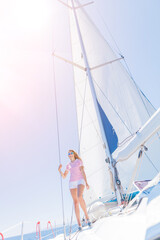 Beautiful Girl relaxing with On Yacht in Greece