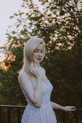 Young beautiful blonde woman in the park.