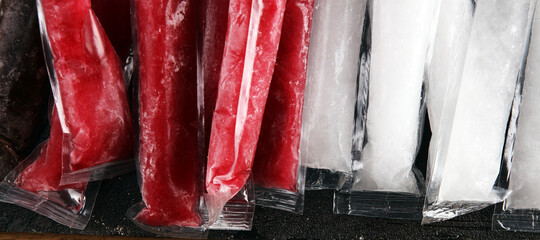 Colorful frozen fruit bar ice pops. Frozen Popsicles