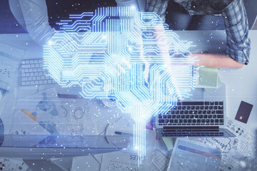 Double exposure of man and woman working together and human brain hologram drawing. Brainstorm concept. Computer background. Top View.