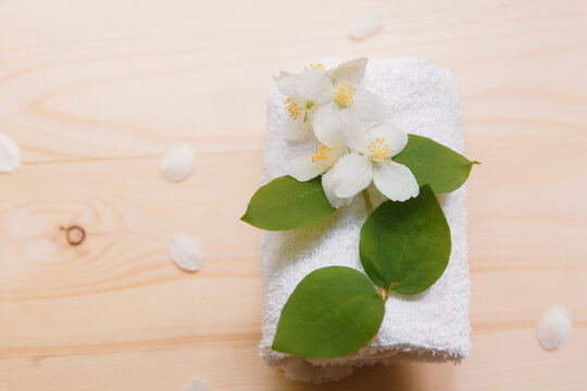 Spa still life with towels and jasmine flowers.