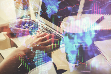 Double exposure of woman hands typing on computer and forex chart hologram drawing. Stock market invest concept.