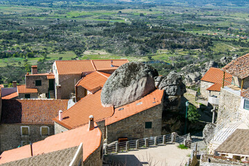Fototapeta na wymiar Stone houses between large rocks in the city of Monsanto - Portugal. Monsanto medieval village