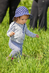 child with hat walking