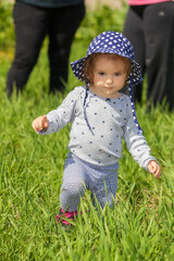 child with hat walking