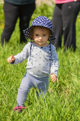 child with hat walking