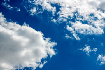 White clouds on a blue background. Horizontal photography.