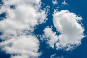 White clouds on a blue background. Horizontal photography.
