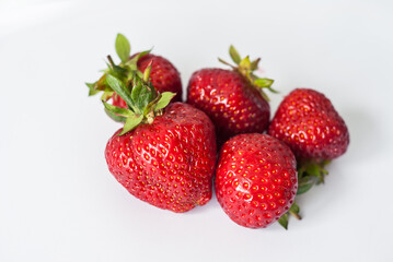 Eco or Bio Strawberry on White Background - Five Berries Composition Isolated Close up View Shot with Natural Light