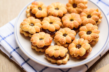 Cracker with pineapple jam (flower shape) on plate, Thai snack