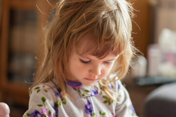 a cute girl playing at home