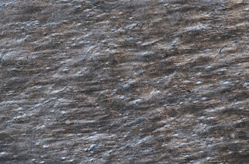 texture of dark gray and brown granite, closeup.