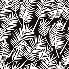 Hand drawn sketch style silhouette of palm leaves on dark background. Vector seamless pattern for textile, card, print.