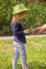 a girl with a green hat