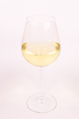 Glass of white wine on white background isolated