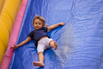 jumping and descending on a rubber slide