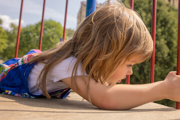 Girl in a park on equipment