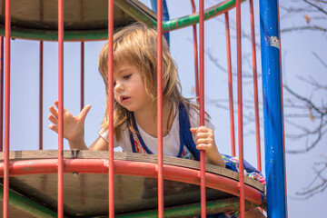 Girl in a park on equipment