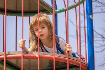 Girl in a park on equipment