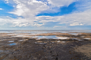 Lake Ebeity (Omsk region, Russian Federation), large salt lake with therapeutic mud. Beautiful natural view of pond and blue sky. Trip on weekend.