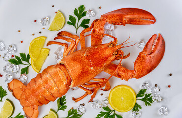 Boiled crab with lemon, parsley and black pepper on white background.