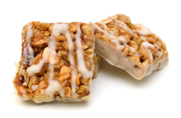 Honey bars with peanuts on white background
