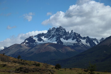 
snowy mountain between Chilean Patagonian forest