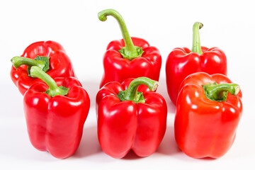 Red ripe peppers on white background, healthy nutrition
