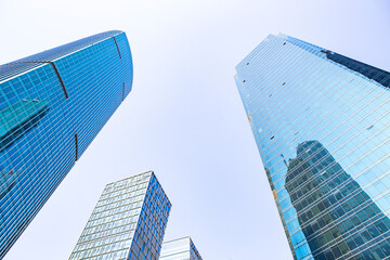 Fototapeta na wymiar Modern skyscraper in Shanghai, with blue sky in the back.