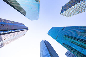 Obraz na płótnie Canvas Modern skyscraper in Shanghai, with blue sky in the back.