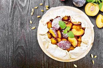 Galeta with plums on board top
