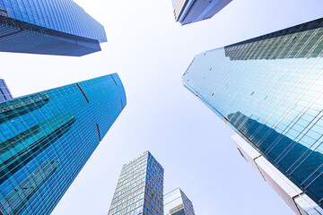 Obraz na płótnie Canvas Modern skyscraper in Shanghai, with blue sky in the back.