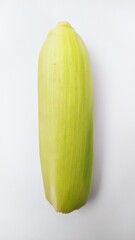 Close up fresh yellow sweet corn isolated on white background