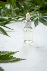 Cosmetics with cannabis oil on a white background. The concept of luxurious skin care.
