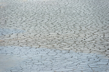 Beautiful background pattern of soil surface fracture which is sedimentation of mineral deposits at...