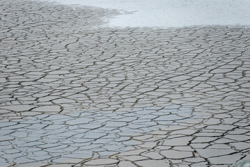 Beautiful background pattern of soil surface fracture which is sedimentation of mineral deposits at...