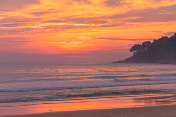 .The sun fell on the horizon in the sea at Karon beach Phuket.