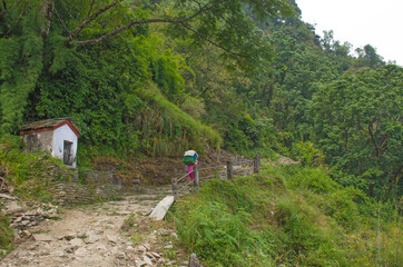 Tourists follow the trail among the mountains of Nepal Himalayas
