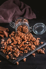 Muesli with chocolate chips on dark background